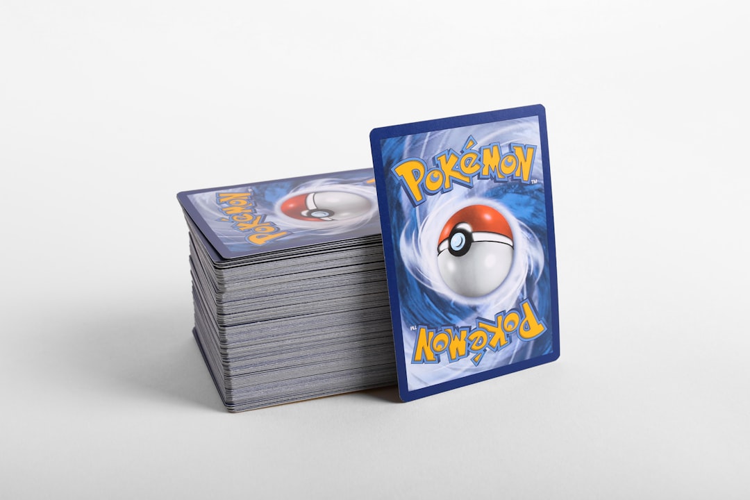 a-stack-of-pokemon-cards-sitting-on-top-of-each-other-i1yfiuhwozi
